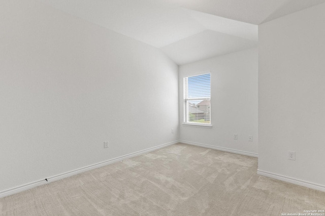 15239 Sirius Cir, San Antonio, TX 78245 - spare room featuring light colored carpet, vaulted ceiling, and baseboards