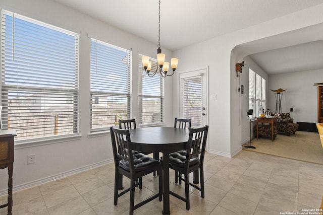 15239 Sirius Cir, San Antonio, TX 78245 - dining area featuring a chandelier, baseboards, and light tile patterned floors
