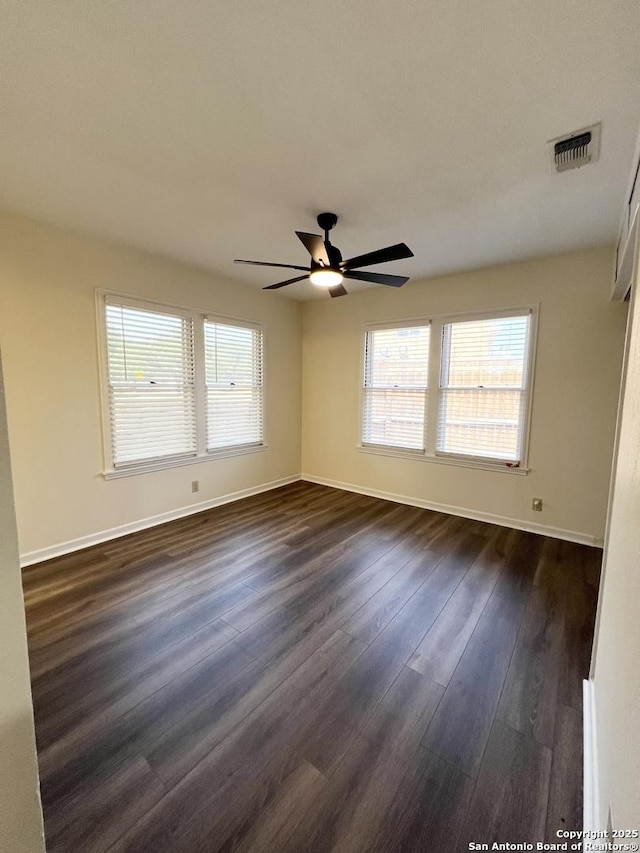 258 Galway, San Antonio, TX 78223 - empty room featuring baseboards, dark wood finished floors, and a ceiling fan