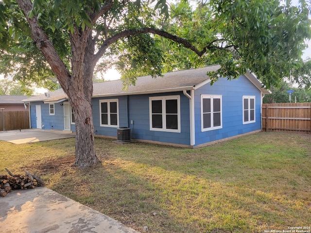 258 Galway, San Antonio, TX 78223 - ranch-style home with a patio area, central AC unit, and roof with shingles