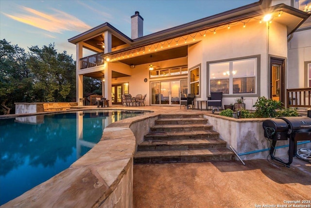406 Breathless View St, San Antonio, TX 78260 - back of house featuring a balcony, french doors, a patio area, stucco siding, and a chimney