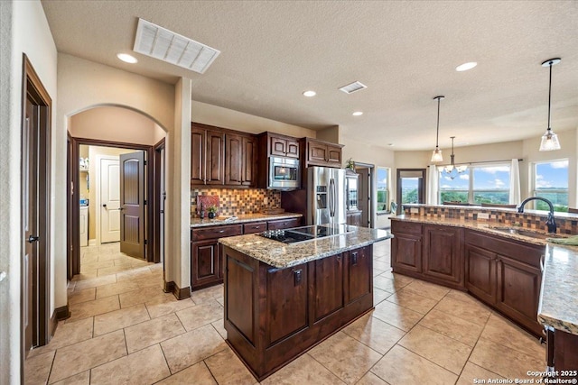 406 Breathless View St, San Antonio, TX 78260 - kitchen with stainless steel appliances, a sink, tasteful backsplash, recessed lighting, and dark brown cabinetry