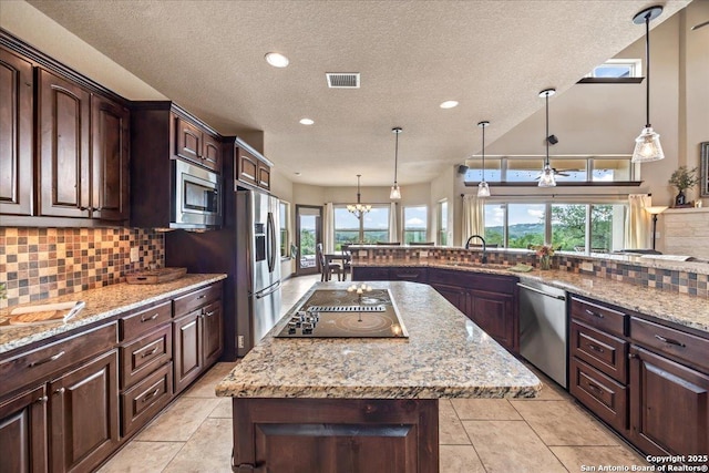 406 Breathless View St, San Antonio, TX 78260 - kitchen featuring stainless steel appliances, tasteful backsplash, a textured ceiling, a sink, and recessed lighting