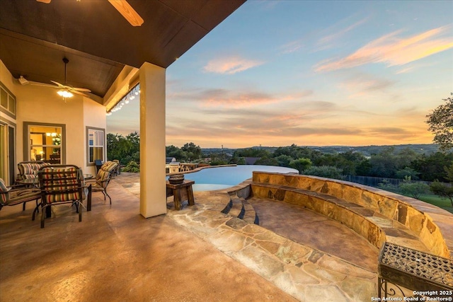 406 Breathless View St, San Antonio, TX 78260 - view of swimming pool with a ceiling fan, an infinity pool, a patio, and outdoor dining space