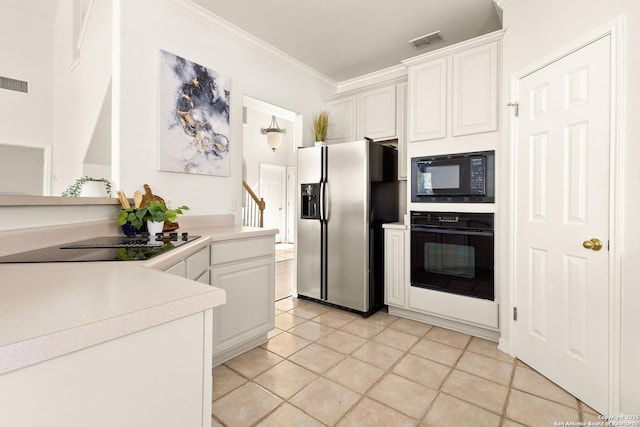 116 Seth Raynor, New Braunfels, TX 78130 - kitchen with black appliances, ornamental molding, white cabinetry, light countertops, and light tile patterned floors