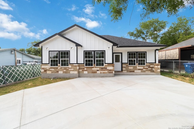 127 Hopi, San Antonio, TX 78211 - view of front facade featuring board and batten siding and roof with shingles