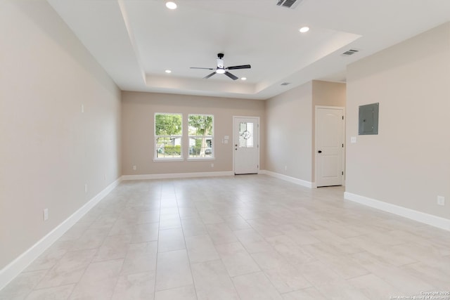 127 Hopi, San Antonio, TX 78211 - empty room featuring a tray ceiling, ceiling fan, recessed lighting, electric panel, and baseboards
