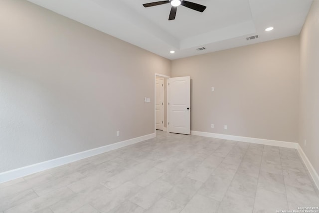 127 Hopi, San Antonio, TX 78211 - empty room featuring ceiling fan, recessed lighting, a tray ceiling, and baseboards