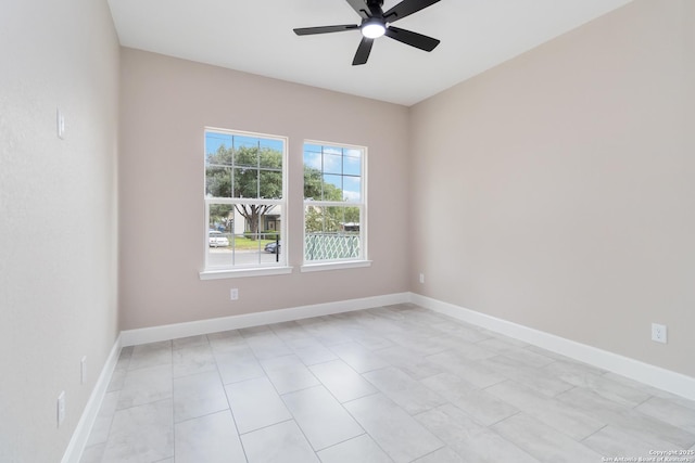 127 Hopi, San Antonio, TX 78211 - empty room with a ceiling fan, baseboards, and light tile patterned floors
