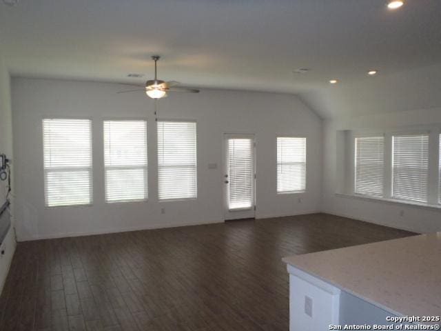 5919 Corsicana, Seguin, TX 78155 - unfurnished living room featuring wood finished floors, a ceiling fan, lofted ceiling, and recessed lighting