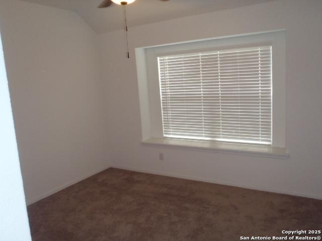 5919 Corsicana, Seguin, TX 78155 - spare room with carpet flooring, ceiling fan, and vaulted ceiling