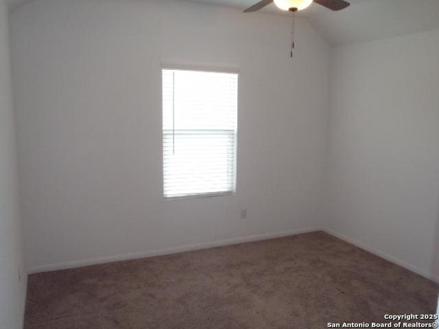 5919 Corsicana, Seguin, TX 78155 - carpeted spare room featuring ceiling fan, plenty of natural light, lofted ceiling, and baseboards