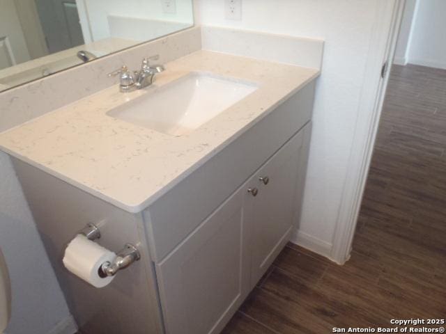 5919 Corsicana, Seguin, TX 78155 - bathroom featuring wood finished floors, vanity, and baseboards