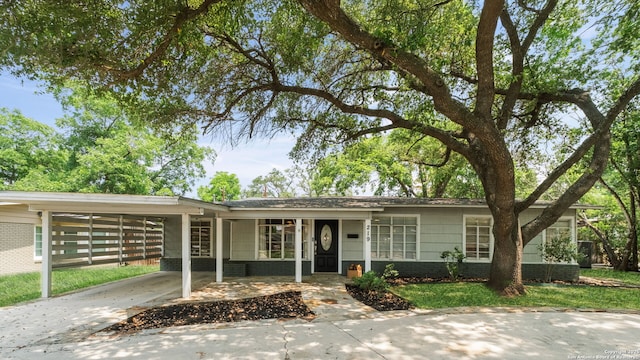 219 Ridgehaven, San Antonio, TX 78209 - single story home featuring driveway, an attached carport, a front yard, and brick siding