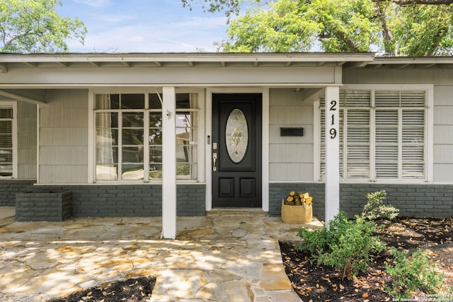219 Ridgehaven, San Antonio, TX 78209 - entrance to property featuring brick siding and a porch