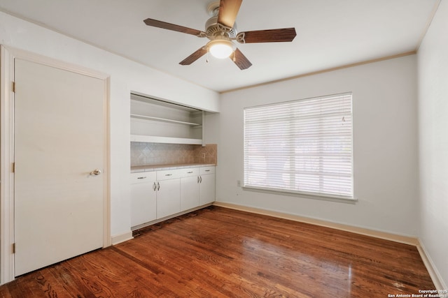 219 Ridgehaven, San Antonio, TX 78209 - empty room with a ceiling fan, wood finished floors, and baseboards