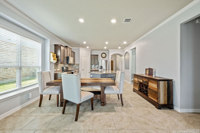 13818 Cohan Way, San Antonio, TX 78253 - dining area featuring arched walkways, ornamental molding, recessed lighting, baseboards, and light tile patterned floors