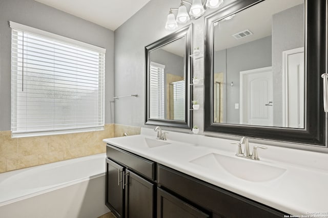13818 Cohan Way, San Antonio, TX 78253 - full bathroom with double vanity and a bath