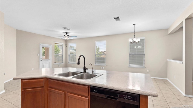 4527 Southton Way, San Antonio, TX 78223 - kitchen featuring black dishwasher, a sink, light tile patterned flooring, light countertops, and hanging light fixtures