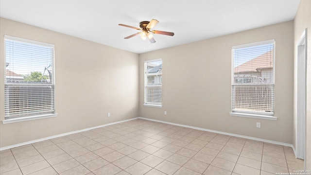 4527 Southton Way, San Antonio, TX 78223 - spare room with a ceiling fan, baseboards, and light tile patterned floors
