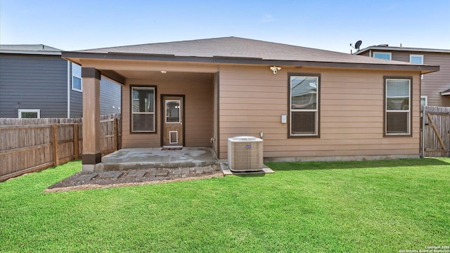 4527 Southton Way, San Antonio, TX 78223 - rear view of house with central air condition unit and a patio area