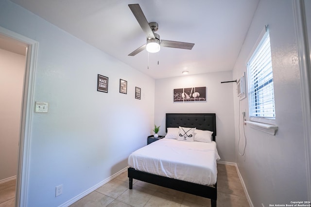 555 Hansford, San Antonio, TX 78210 - tiled bedroom with baseboards and a ceiling fan