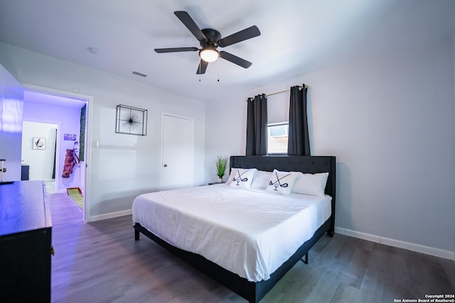 555 Hansford, San Antonio, TX 78210 - bedroom featuring dark wood-style floors, baseboards, and a ceiling fan