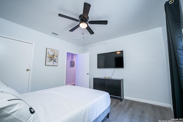 555 Hansford, San Antonio, TX 78210 - bedroom with wood finished floors, baseboards, and a ceiling fan