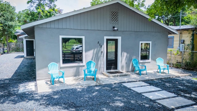 555 Hansford, San Antonio, TX 78210 - back of property with stucco siding and a patio area