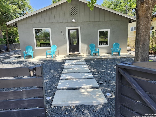 555 Hansford, San Antonio, TX 78210 - back of property featuring stucco siding and a patio area
