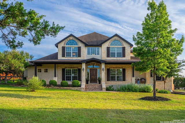 154 Lake View Dr, Boerne, TX 78006 - view of front of property with a front lawn, stone siding, and roof with shingles