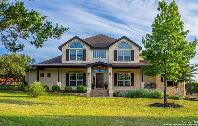 154 Lake View Dr, Boerne, TX 78006 - view of front of home featuring a front lawn, a shingled roof, a porch, and stone siding