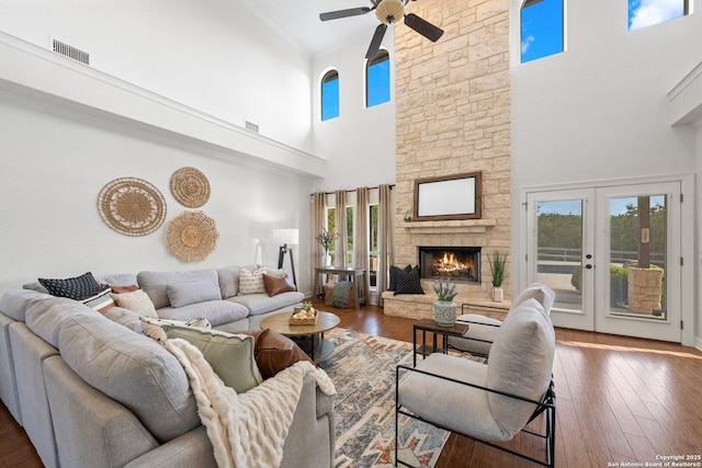 154 Lake View Dr, Boerne, TX 78006 - living area featuring a towering ceiling, healthy amount of natural light, ceiling fan, a fireplace, and ornamental molding