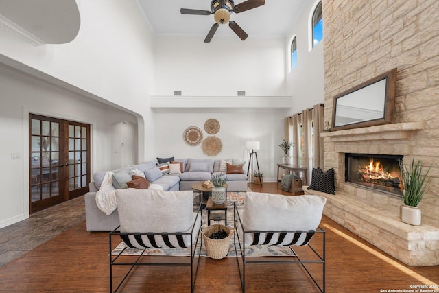 154 Lake View Dr, Boerne, TX 78006 - living room with french doors, a towering ceiling, ceiling fan, a fireplace, and baseboards