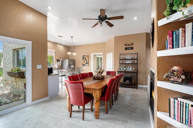 177 Ten W Dr, Comfort, TX 78013 - dining space with ceiling fan, a fireplace, baseboards, and recessed lighting