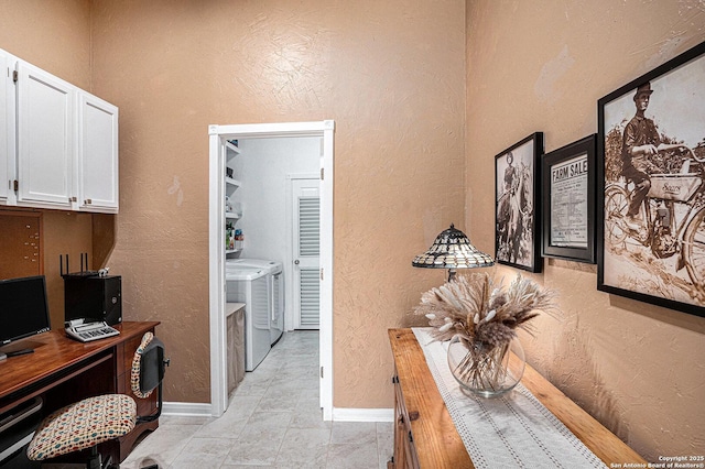 177 Ten W Dr, Comfort, TX 78013 - office area featuring washing machine and clothes dryer, a textured wall, and baseboards