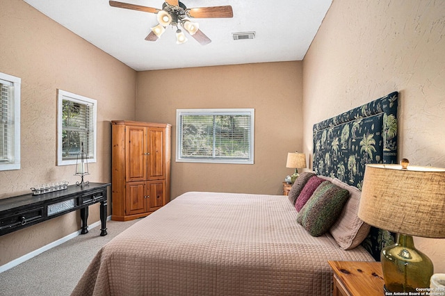 177 Ten W Dr, Comfort, TX 78013 - carpeted bedroom featuring a textured wall, ceiling fan, and baseboards
