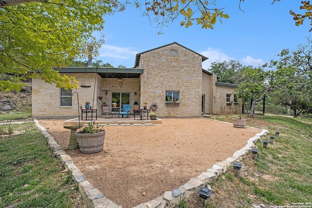 177 Ten W Dr, Comfort, TX 78013 - back of property featuring stone siding, a patio, and a ceiling fan
