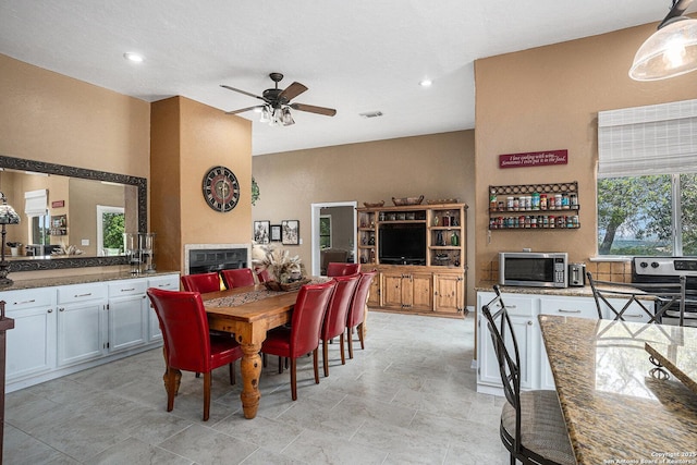 177 Ten W Dr, Comfort, TX 78013 - dining space featuring a ceiling fan, recessed lighting, and a fireplace