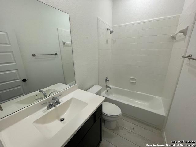 12023 Horseshoe, San Antonio, TX 78254 - bathroom featuring vanity, toilet, and shower / bathtub combination