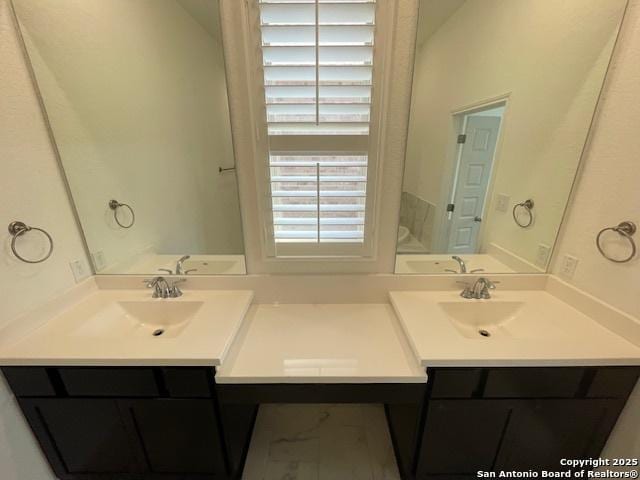 12023 Horseshoe, San Antonio, TX 78254 - full bath featuring double vanity and marble look tile flooring