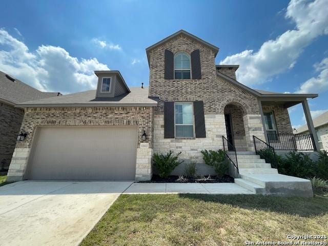 12023 Horseshoe, San Antonio, TX 78254 - view of front of home featuring brick siding, an attached garage, and concrete driveway