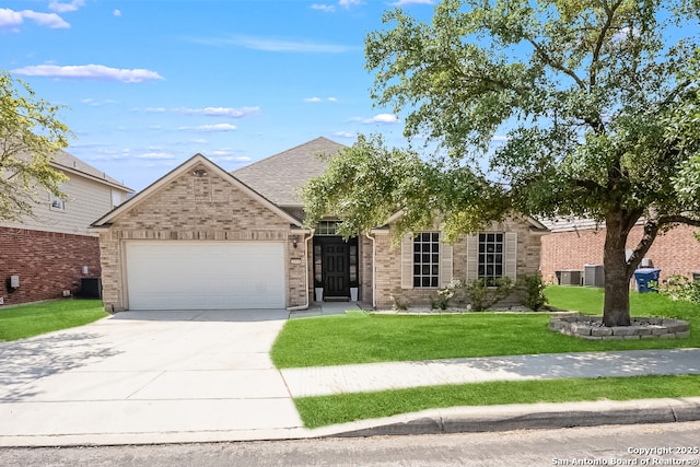 21931 Ruby Run, San Antonio, TX 78259 - view of front facade featuring a garage, driveway, a front lawn, brick siding, and central AC