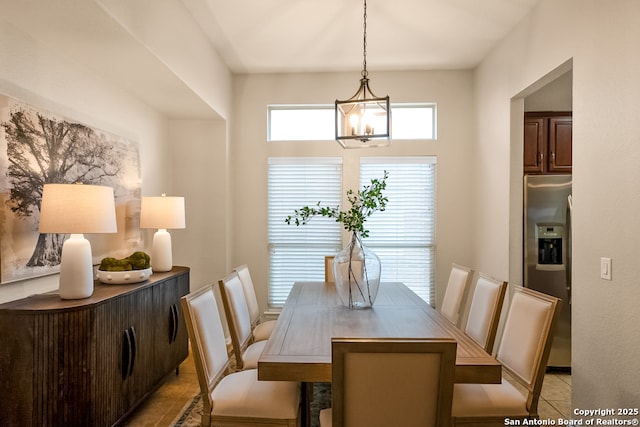 21931 Ruby Run, San Antonio, TX 78259 - dining space with a chandelier and light tile patterned floors