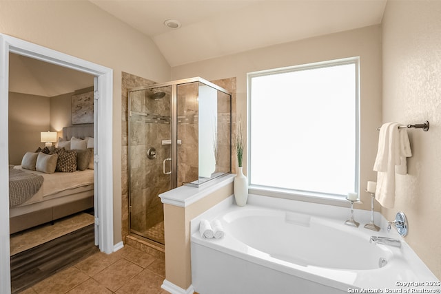 21931 Ruby Run, San Antonio, TX 78259 - ensuite bathroom featuring a bath, a stall shower, tile patterned flooring, and lofted ceiling