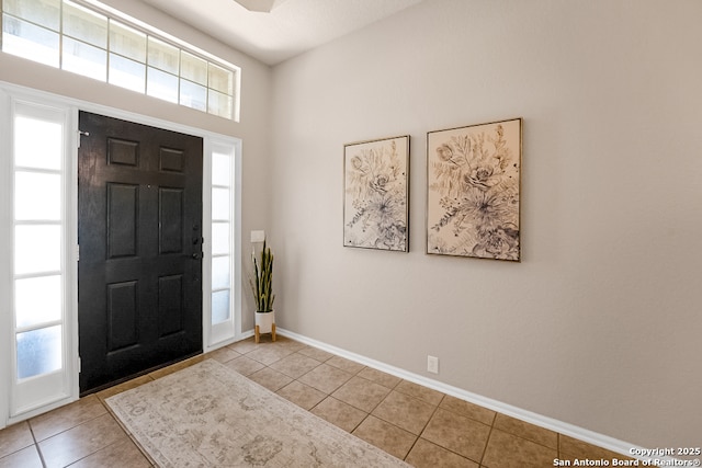 21931 Ruby Run, San Antonio, TX 78259 - entryway featuring light tile patterned floors, plenty of natural light, and baseboards