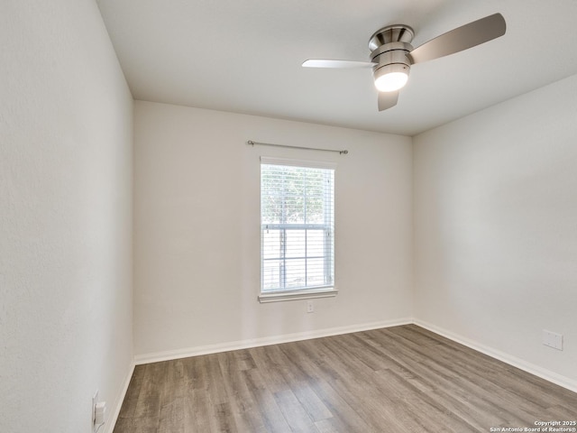 7071 Capeshaw, San Antonio, TX 78252 - unfurnished room with wood finished floors, a ceiling fan, and baseboards