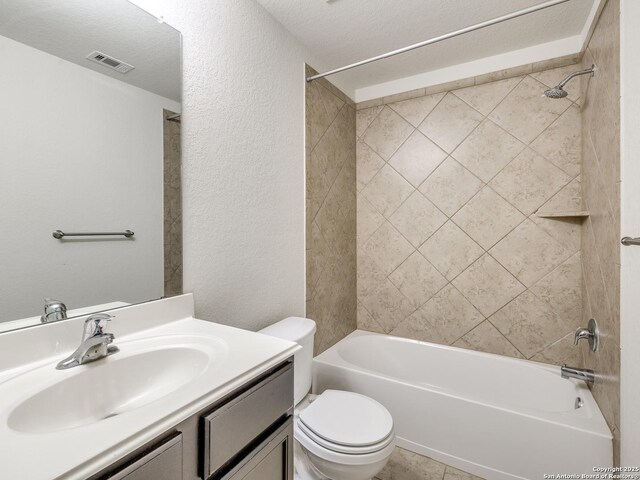 7071 Capeshaw, San Antonio, TX 78252 - bathroom featuring toilet,  shower combination, vanity, and a textured wall