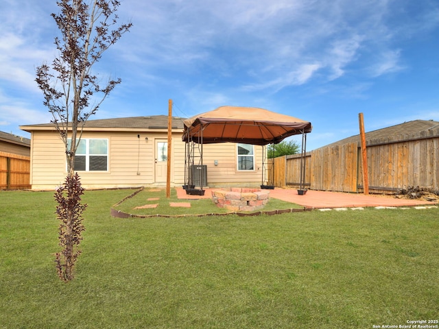 7071 Capeshaw, San Antonio, TX 78252 - back of property with a gazebo, a patio, and central AC