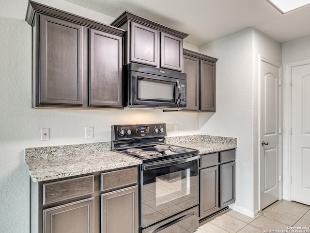 7071 Capeshaw, San Antonio, TX 78252 - kitchen featuring black appliances, light tile patterned floors, and dark brown cabinetry